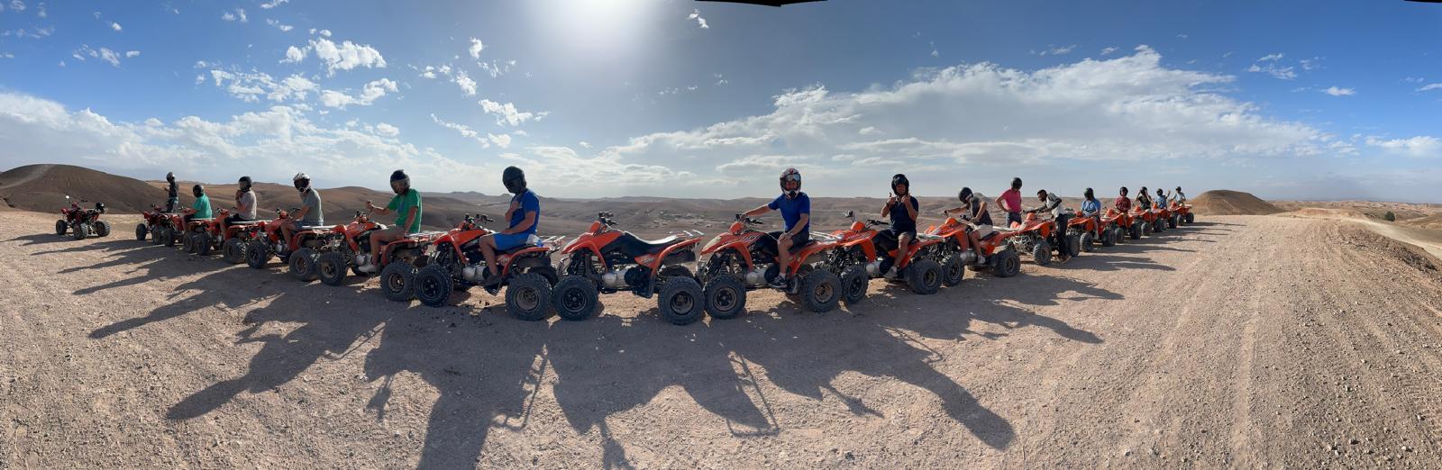 The group lined up with quad bikes in the Marrakech desert